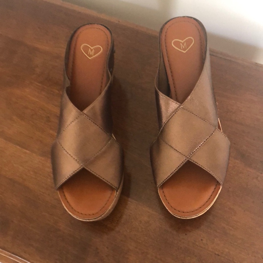 Copper wedge candle with cork wedge.